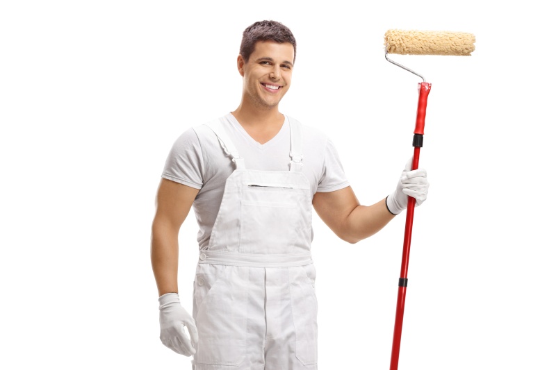 Young painter with a paint roller
