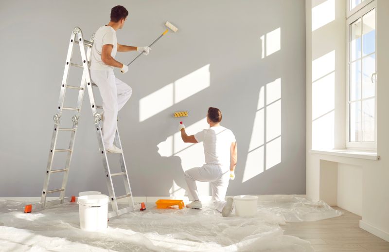 Team Professional Painters White Clothes Painting Grey Wall Empty Room