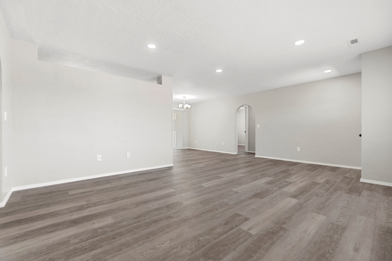 Empty Living Room Featuring Beautiful Hardwood Floors Freshly Painted